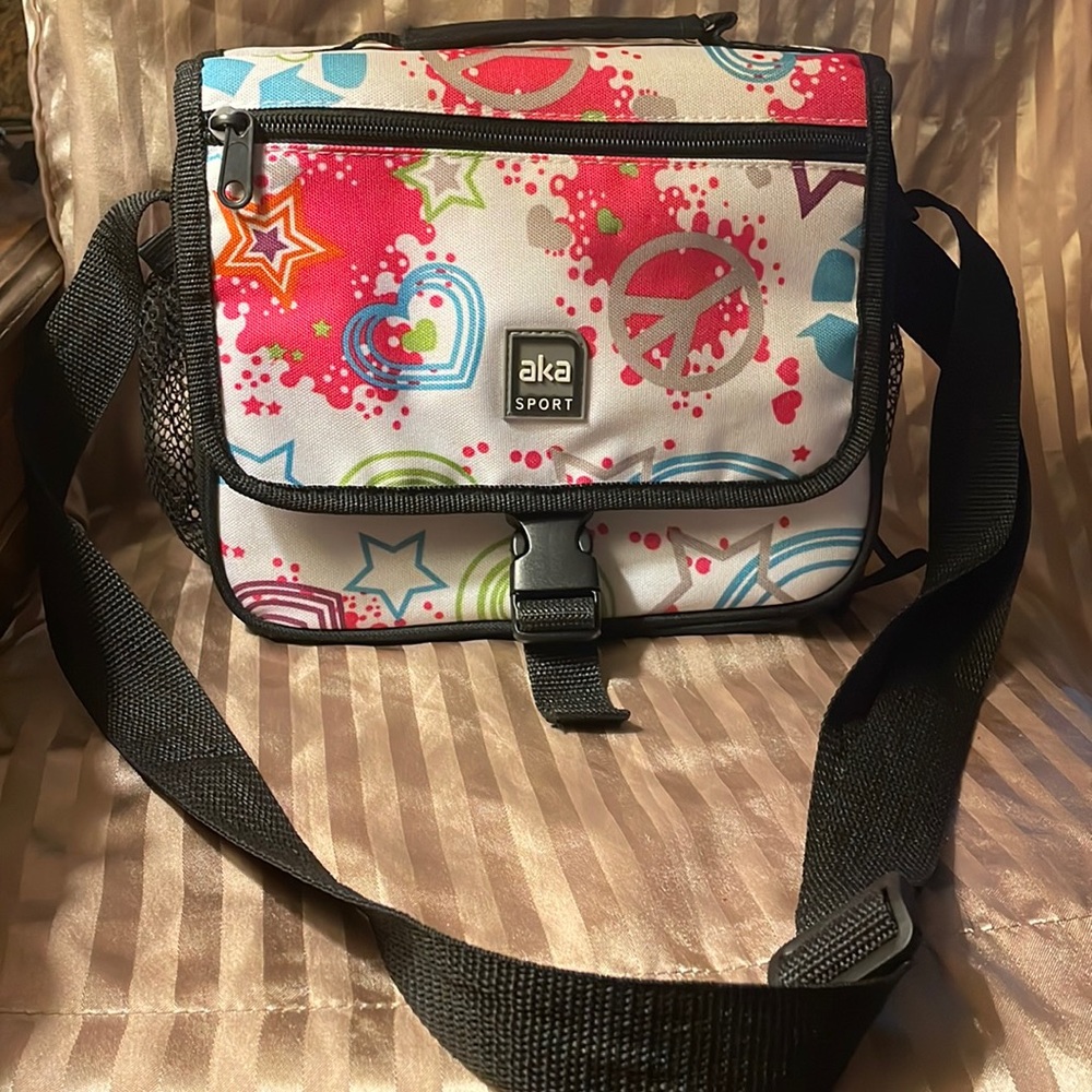 aka sport girls lunch bag. It is neon colored with peace, heart & piece sign.
